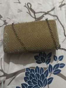 Elegant Gold Clutch with Chain