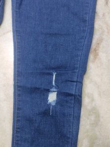 Distressed Blue Denim Jeans