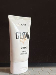 Tinted Moisturiser , Lipstick And A Lip Gloss