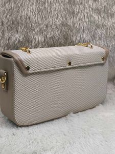 Chic Crossbody Bag with Chain Detail