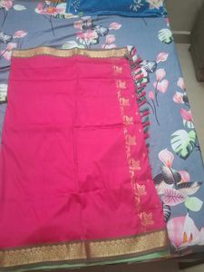 Elegant Pink Saree with Golden Details