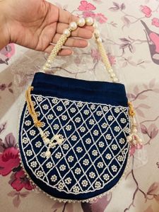 Elegant Heavy Blue Pearl Potli Bag with Tassels