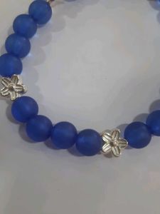 Blue Beaded Bracelet with Silver Flowers