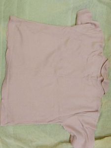 A beautiful peach coloured crop shirt