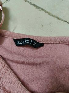 A Pink Crop Top With Pullup Strings In The Size M