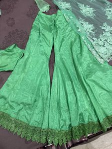 green shrara with long cap