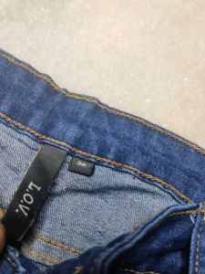 Distressed Blue Denim Jeans