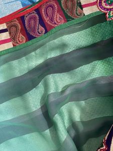 New🔥 Elegant Green N Purple Striped Saree