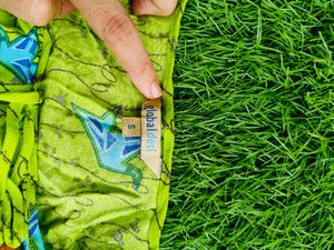 Flourescent green 💚 tunic with blue origami birds