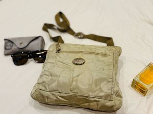 Authentic coach golden sling bag