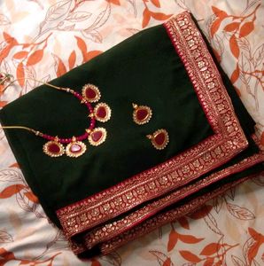 Elegant Green Saree with Pink Border