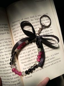 onion pink Beaded Keychain with black ribbon