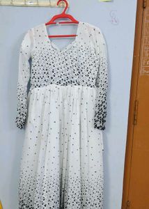 White frock with black dots design..