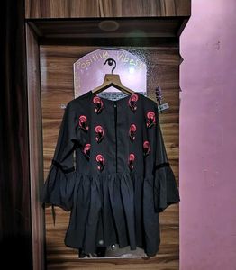 Embroidered Peplum Top
