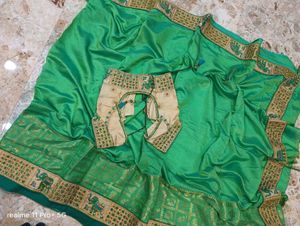 Elegant Green Silk Saree with Elephant Border