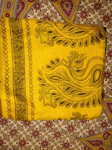 Yellow Cotton Saree With Green Border.