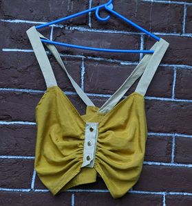 mustard yellow crop top .