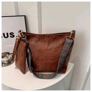 Grey Handbag with Colorful Strap