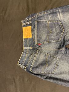 Distressed Mid-Wash Levi’s Jeans”