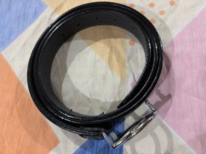 A black belt with silver buckle