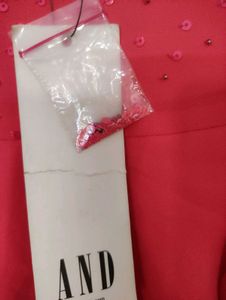 Pink Coloured A-line Dress With Sequence On Top.