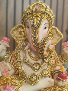 Ganesha Statue with Fruit Offerings