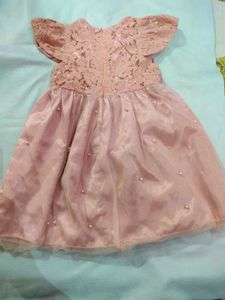 A Used Baby Girl Peach Color Frock