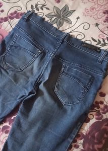 Fadded Damaged Blue Jeans