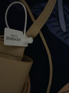 classy beige slingbad/handbag with two belts