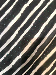 Green,red,black and white standard saree.
