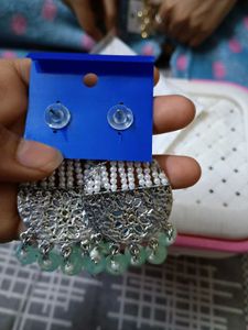 a pair of lightweight ethnic white earrings with