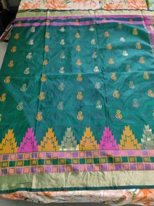 Green kanchipuram silk saree.