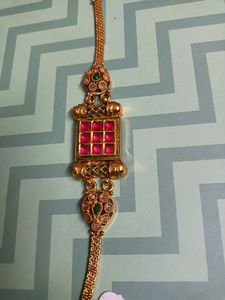 Gold Tone Bracelet with Red and Green Stones