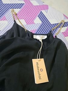 Black dress with sling bag