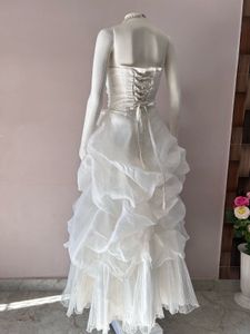 VOLUMINOUS RUFFLED ORGANZA WEDDING GOWN