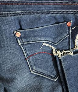 Blue jeans with beautiful red threadwork