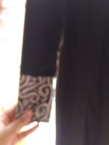Black Skirt with Embroidered Hem