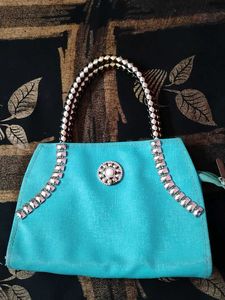 Teal Handbag with Embellishments