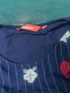 Embroidered peplum top