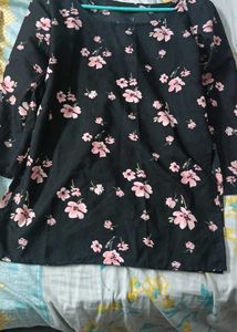 Black Short Kurti With Printed Flower On It