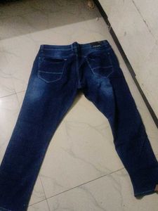 Distressed Blue Denim Jeans