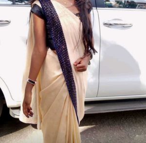 Elegant Beige Saree with grand blue border