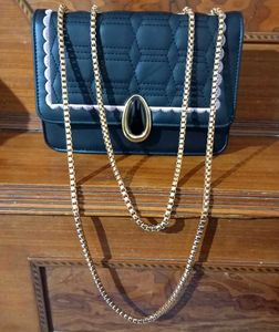 spacious black sling bag