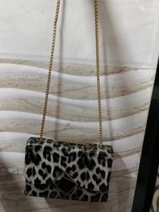 This Is A Sling Bag It Has Cheetah Print