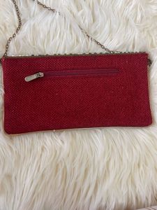 It’s a brown party wear clutch