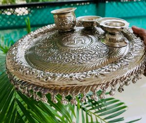 Karva chauth Pooja thali German and silver antique thali mor info inbox me**item code: Swastik pooja thali set**Thali size:Diameter 11”2 katoris1 kalash loti1 deepam
