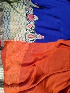 Elegant Blue and orange Saree with golden net