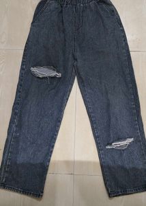 Unisex wide-leg distressed jeans.