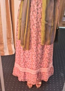 A pink floral gown with white lace trim
