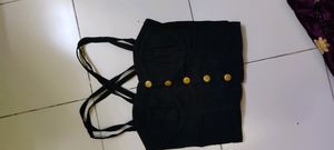 black crop top with cross straps